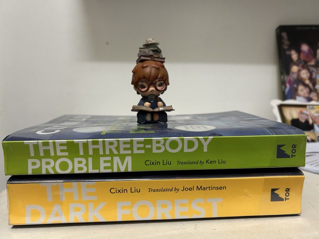 Cixin Liu's The Three-Body Problem & The Dark Forest (Category: Storybooks) located in Manila. Submitted by dobbeyyy (Listing ID 1424274637, Image 1). Description: - Cixin Liu's 'The Three-Body Problem' (translated by Ken Liu) and 'The Dark Forest' (translated by Joel Martinsen). - Published by TOR. - Stacked together, spines visible..