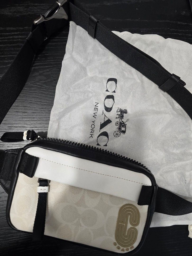 Coach Crossbody & Belt Bag (Category: Luxury Bags & Wallets) located in Cebu City. Submitted by marchander (Listing ID 1424229028, Image 2). Description: - Authentic Coach belt bag - Signature black and white Coach pattern - Main compartment and interior pocket - Includes dust bag and Coach tag - Adjustable strap with metal buckle - Zipper closure - Rarely used / like new.