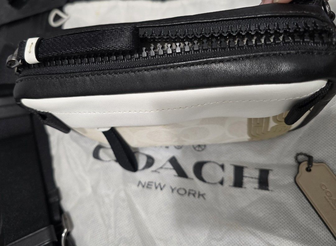 Coach Crossbody & Belt Bag (Category: Luxury Bags & Wallets) located in Cebu City. Submitted by marchander (Listing ID 1424229028, Image 3). Description: - Authentic Coach belt bag - Signature black and white Coach pattern - Main compartment and interior pocket - Includes dust bag and Coach tag - Adjustable strap with metal buckle - Zipper closure - Rarely used / like new.