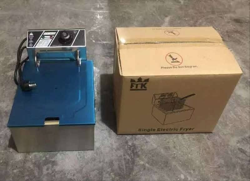 Deep fryer (Category: Cookware & Accessories) located in Manila. Submitted by nixdcruz (Listing ID 1424296466, Image 1). Description: Single electric fryer, perfect for home or small business use. The fryer has a blue and silver body with a control panel. It comes with its original box. The box indicates it is a single electric fryer. The brand is FTK..