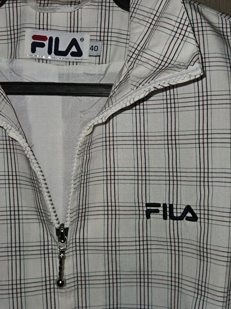 Fila Tennis Plaid Jacket (Category: Coats, Jackets and Outerwear) located in Candon. Submitted by itssummer08 (Listing ID 1424219744, Image 2). Description: - Fila plaid jacket - Size 40, Medium to Large womens oversized boxy fit. - Zipper closure - Embroidered Fila logo - Classic plaid pattern (white, black, red) - Collar and long sleeves L 22 W21.5 Boxy fit.