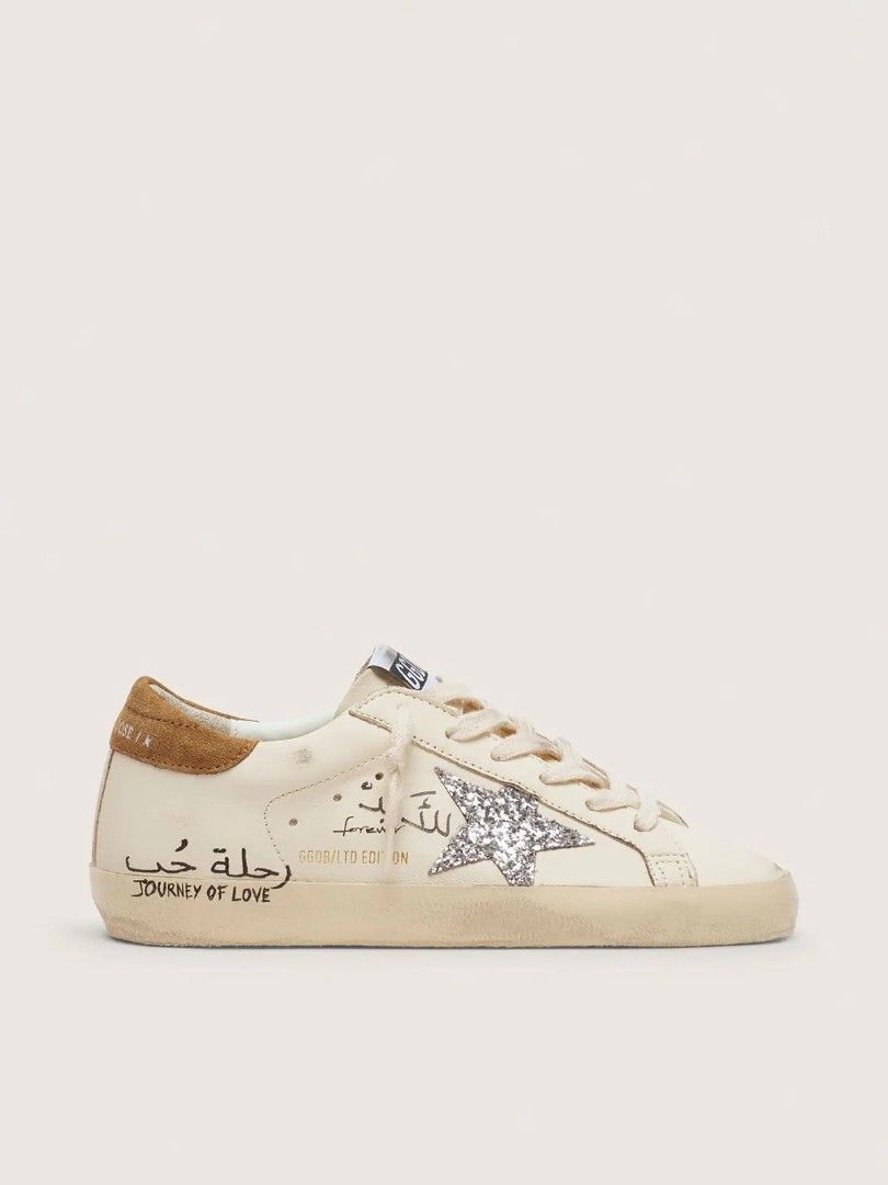 Golden Goose Superstar Sneakers (Category: Sneakers) located in Manila. Submitted by sixthstreetsupply (Listing ID 1424323212, Image 3). Description: Golden Goose sneakers in various designs. Features include star accents, distressed detailing, and unique embellishments. Some pairs have Arabic script and glitter accents. Styles include lace-up and velcro strap closures. The sneakers have a vintage, worn look. PRE ORDER UA PAIR 10-14 DAYS SHIPPING