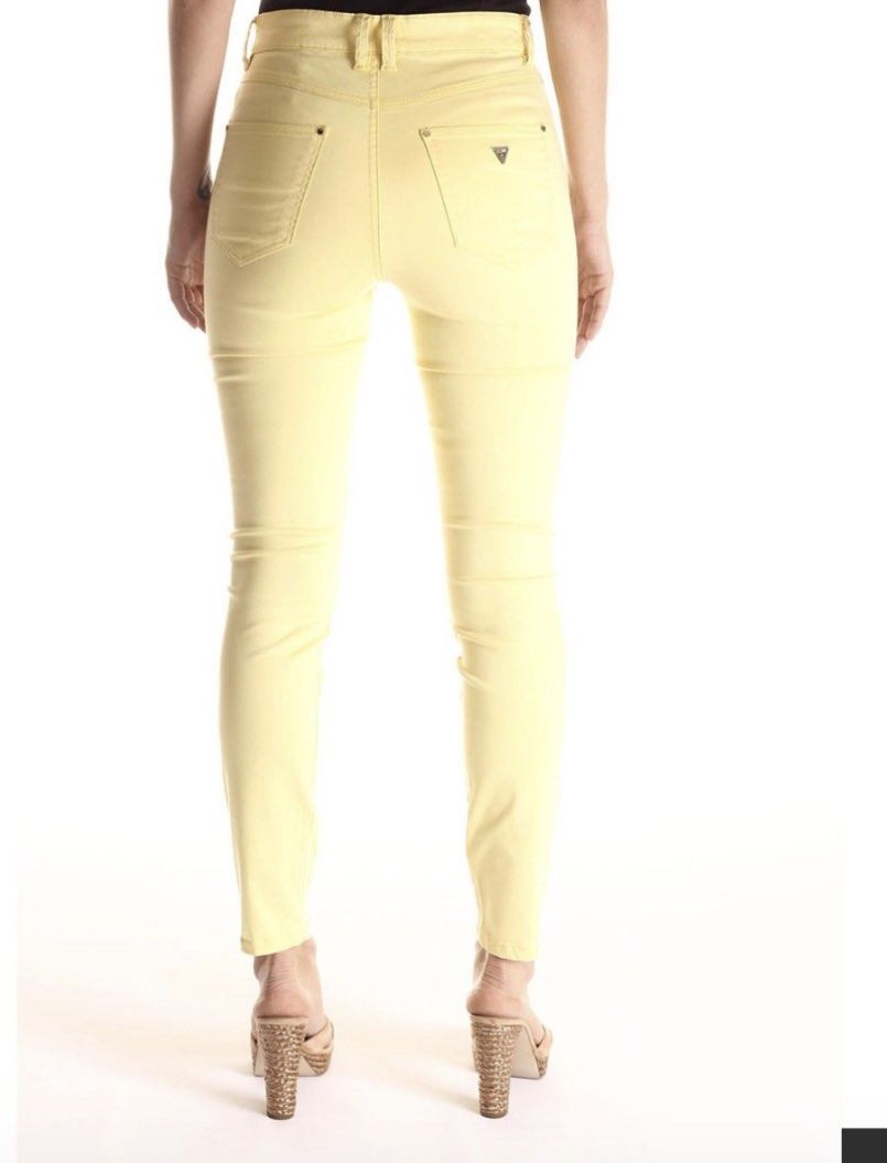 Guess W91B41 Yellow Jeans Size 25 (Category: Jeans) located in Dagupan City. Submitted by againandadorned (Listing ID 1424187566, Image 1). Description: These Guess jeans are a vibrant yellow color. They feature the Guess logo on the back pocket and a small logo patch on the back waistband. The size is 25, and the style is W42A27 W4TH0 4. The jeans are made in Turkey. The material composition includes cotton, viscose, and elastane..