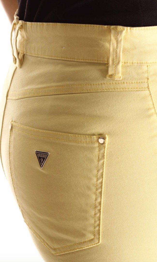 Guess W91B41 Yellow Jeans Size 25 (Category: Jeans) located in Dagupan City. Submitted by againandadorned (Listing ID 1424187566, Image 3). Description: These Guess jeans are a vibrant yellow color. They feature the Guess logo on the back pocket and a small logo patch on the back waistband. The size is 25, and the style is W42A27 W4TH0 4. The jeans are made in Turkey. The material composition includes cotton, viscose, and elastane..