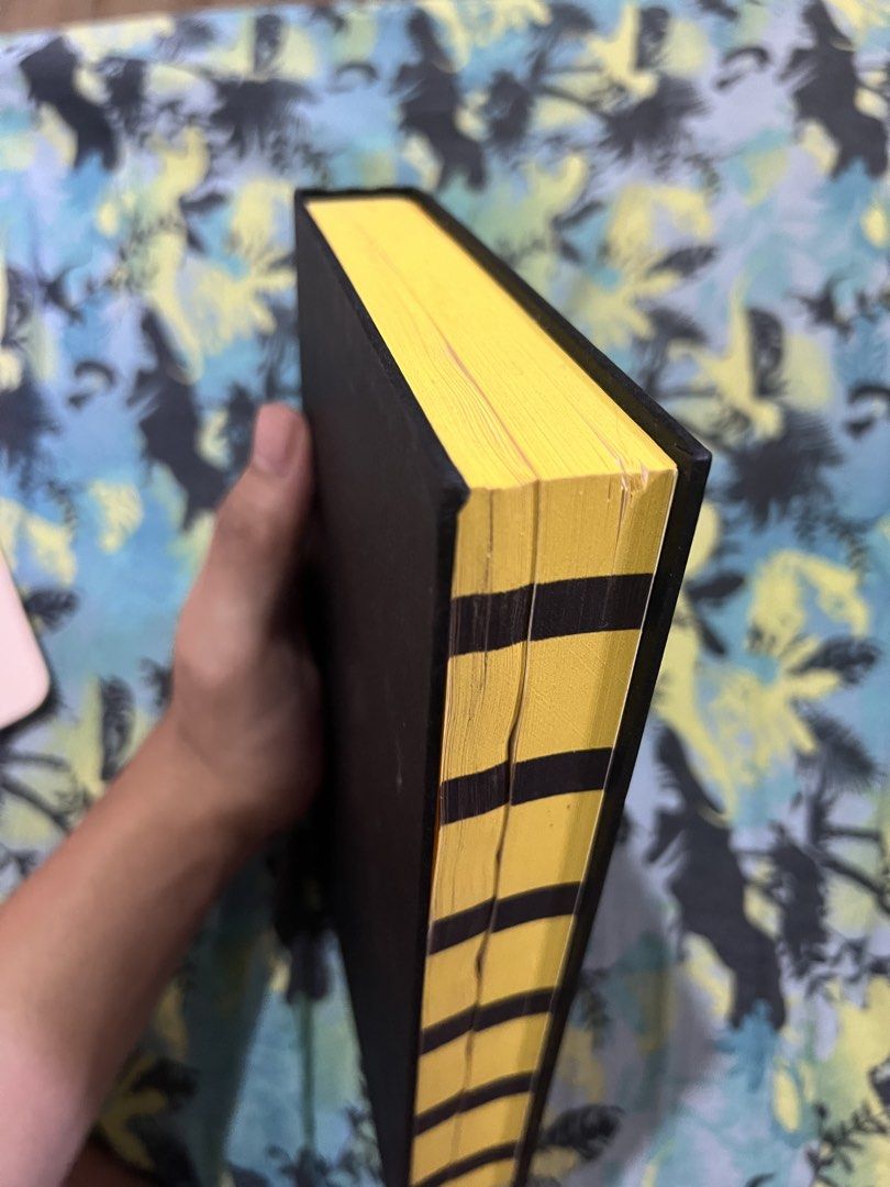 Harry Potter and the Philosopher's Stone Hufflepuff Edition (Category: Storybooks) located in Gapan. Submitted by booknest (Listing ID 1424172640, Image 3). Description: - Harry Potter and the Philosopher's Stone: Hufflepuff Edition - Features a sleek black cover with elegant gold lettering. - Page edges are uniquely designed with yellow and black stripes. - Includes the Hufflepuff crest inside. - Written by J.K. Rowling. No dust jacket , waterma