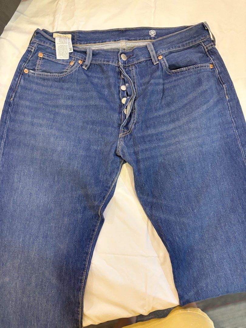 Levi's Premium 501 Button Fly Jeans W36 L32 (Category: Jeans) located in Manila. Submitted by og1022 (Listing ID 1424330734, Image 1). Description: - Levi's Premium 501 Jeans - Classic blue wash - Size: W36 L32 - Button fly closure - Features the Levi's Premium label - "COOL" logo on the back.