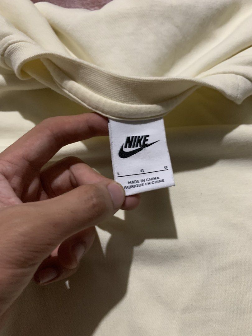 Nike Crewneck Sweatshirt - Cream (Category: Coats, Jackets and Outerwear) located in Butuan. Submitted by rcycl (Listing ID 1424274765, Image 3). Description: - Cream-colored Nike crewneck sweatshirt - Features Nike logo on chest - Size: L - Made in China - Material: 80% cotton, 20% polyester - Chest size on care label: 100cm.