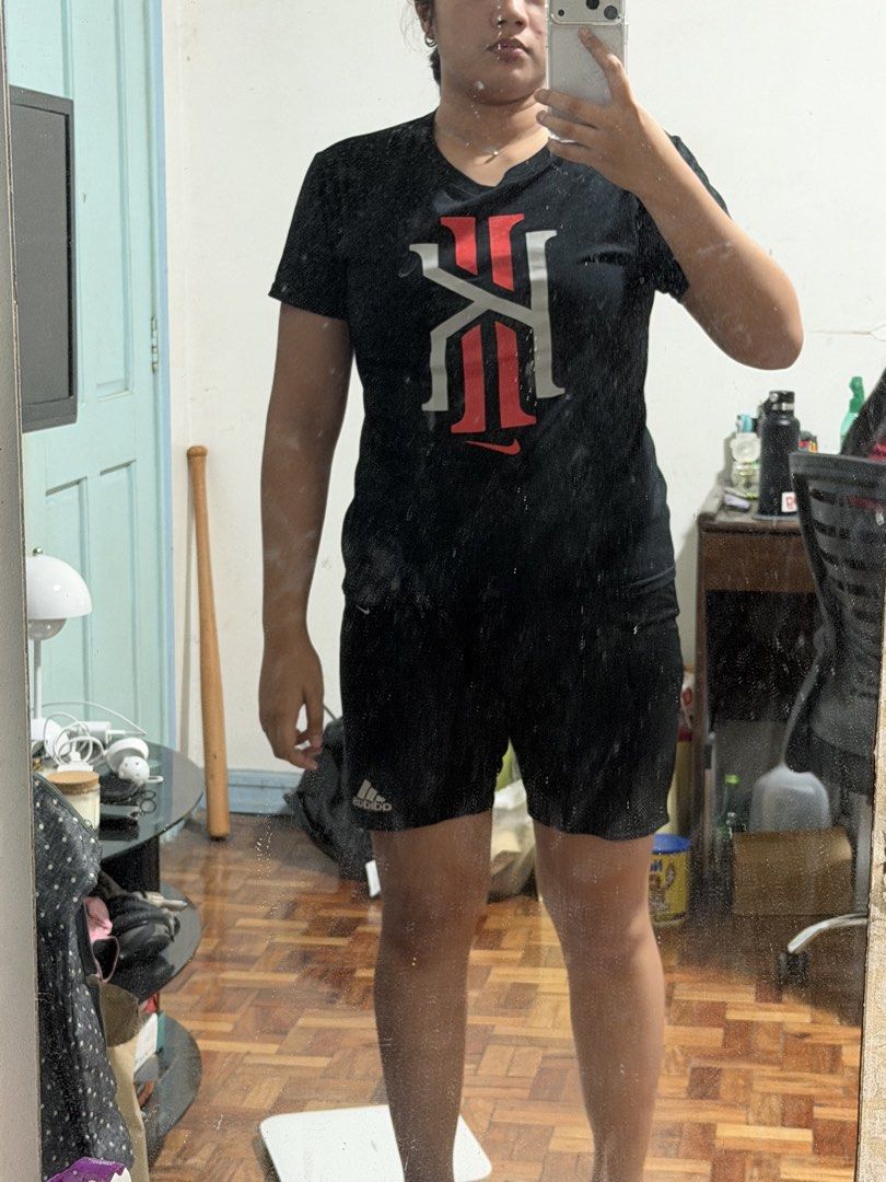 Nike Kyrie Irving Tee Shirt (Category: Tshirts & Polo Shirts ) located in Caloocan City. Submitted by _mitsuki (Listing ID 1424272756, Image 3). Description: ‼️ DECLUTTERING ‼️ Model Height: 5'6 Model Weight: 69.5kg - Black Nike Kyrie Irving tee shirt - Crew neck with red trim - Size M - Athletic cut MOP: Unionbank, MariBank, GoTyme MOD: Any courier, as long as the buyer will shoulder the delivery/shipping fee Location: Caloocan.