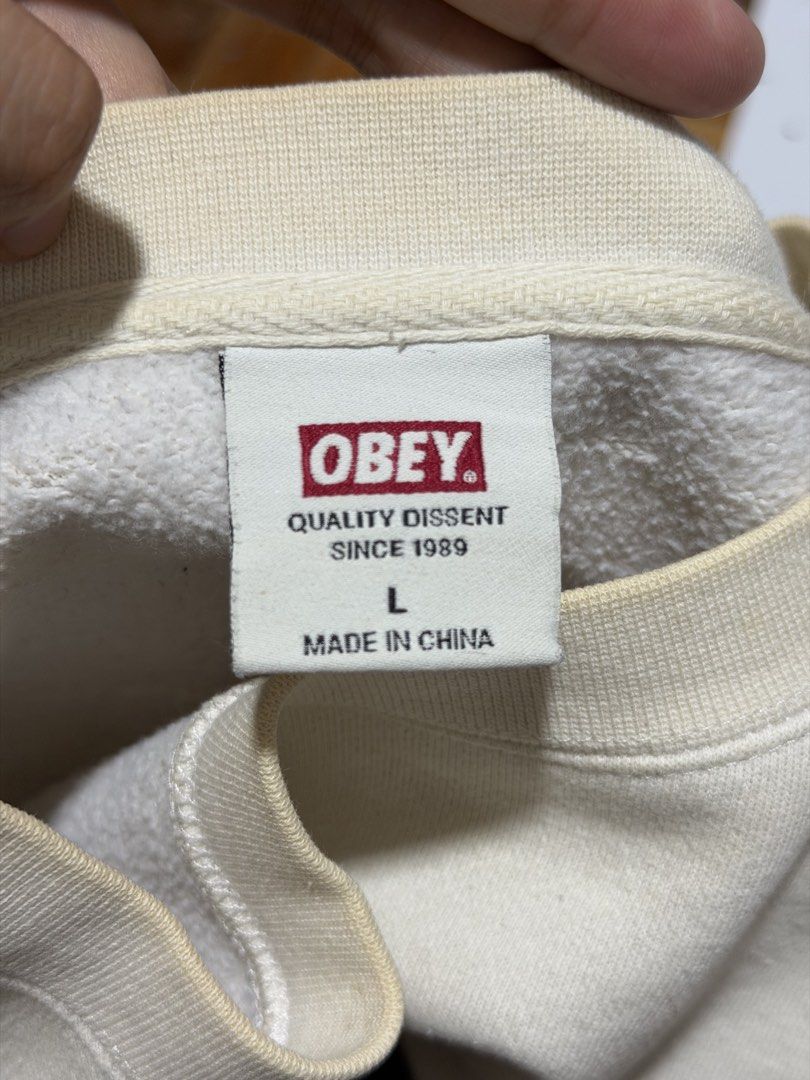 Obey Colorblock Sweatshirt - Size L (Category: Coats, Jackets and Outerwear) located in Caloocan City. Submitted by _mitsuki (Listing ID 1424179113, Image 2). Description: ‼️ DECLUTTERING ‼️ Model Height: 5'6 Model Weight: 69.5kg Obey colorblock sweatshirt in cream and black. Features the Obey logo on the chest. Size L. Made in China. Honest issue: There are some stains on the front and sleeves. MOP: Unionbank, MariBank, GoTyme MOD: Any courier, 