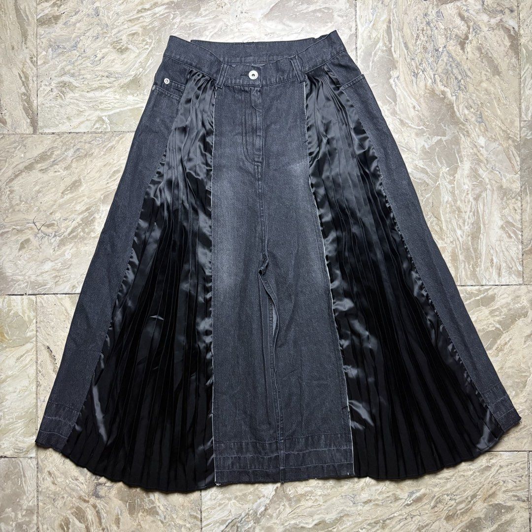 Sacai Pleated Hybrid Skirt (Category: Jeans) located in Dinalupihan. Submitted by hell.thrift (Listing ID 1424259345, Image 3). Description: - Sacai denim jeans -Waitline:28 -Length:30 - Pleated satin panel details - Button and zipper closure - Raw hem design - Made in Japan - Size 2 - Material: Cotton/Polyester.