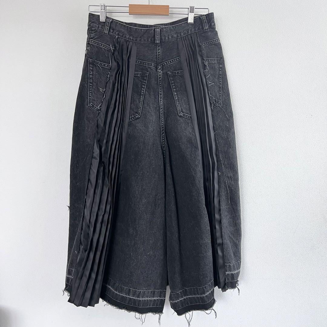 Sacai Pleated Hybrid Skirt (Category: Jeans) located in Dinalupihan. Submitted by hell.thrift (Listing ID 1424259345, Image 2). Description: - Sacai denim jeans -Waitline:28 -Length:30 - Pleated satin panel details - Button and zipper closure - Raw hem design - Made in Japan - Size 2 - Material: Cotton/Polyester.