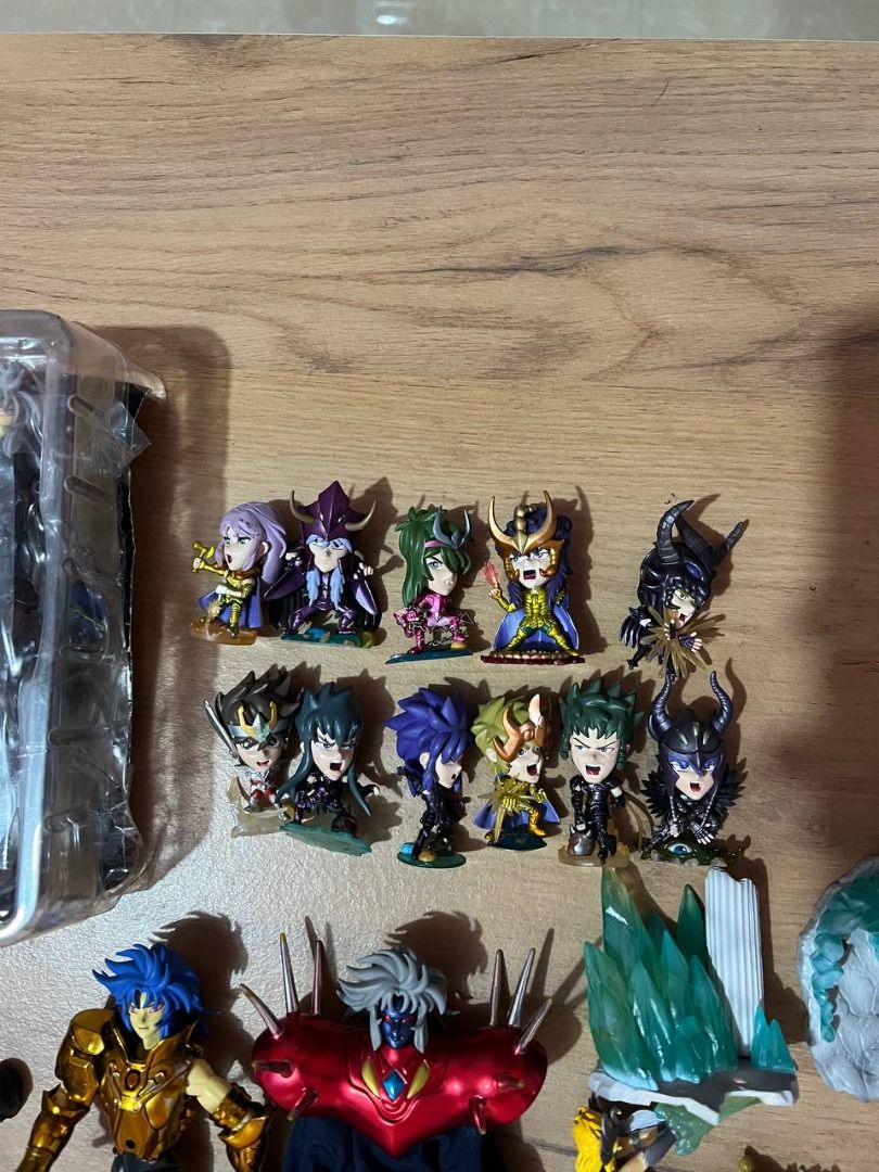 Saint Seiya Action Figures Set (Category: Figurines & Statues) located in Baguio. Submitted by ditoyzb08176 (Listing ID 1424279474, Image 3). Description: Collection of Saint Seiya action figures, including various characters and accessories. The set features multiple figures, some with armor and additional parts. Includes a figure still in its original packaging. Also includes a set of mini figures. Great for collectors and fans of the series. -