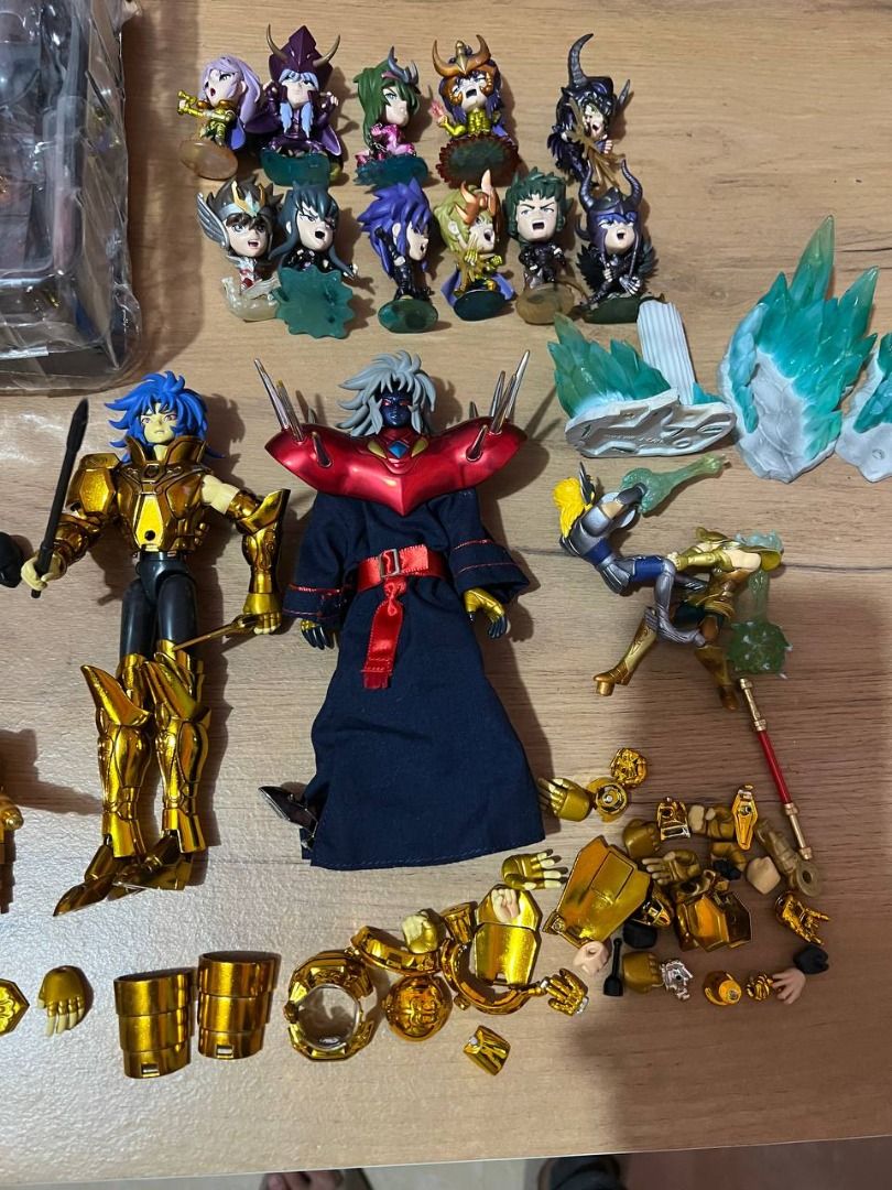 Saint Seiya Action Figures Set (Category: Figurines & Statues) located in Baguio. Submitted by ditoyzb08176 (Listing ID 1424279474, Image 2). Description: Collection of Saint Seiya action figures, including various characters and accessories. The set features multiple figures, some with armor and additional parts. Includes a figure still in its original packaging. Also includes a set of mini figures. Great for collectors and fans of the series. -