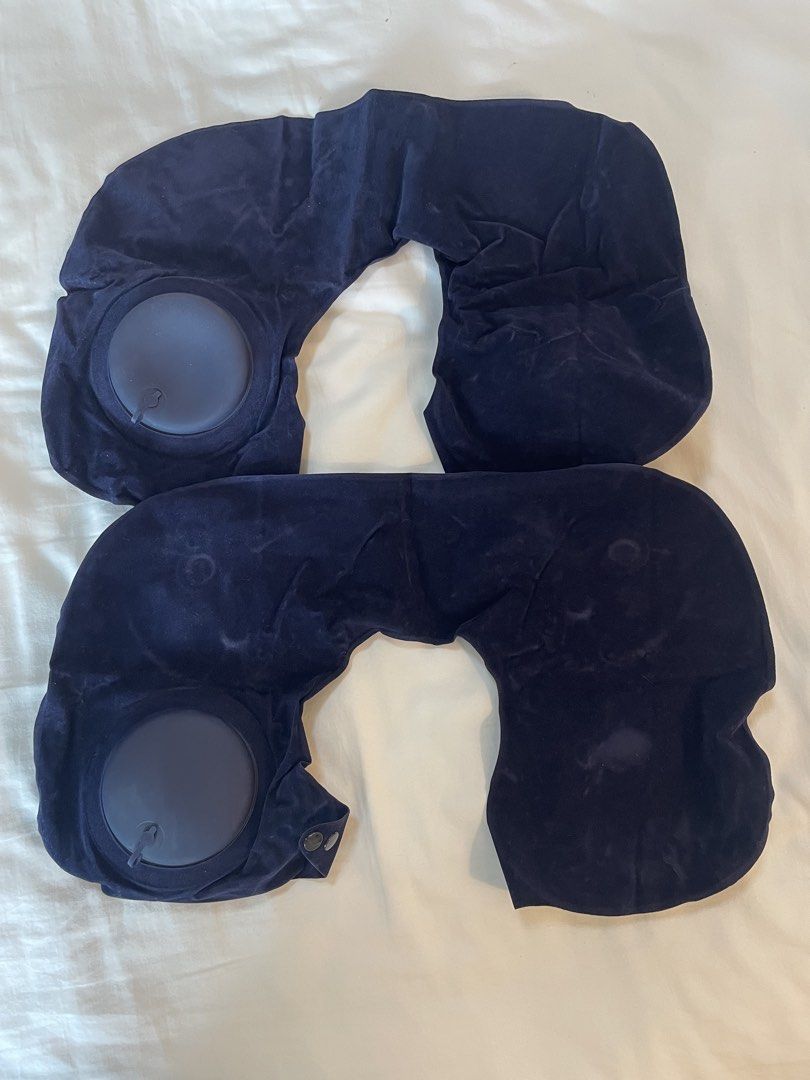 Self Inflating travel Neck Pillow (Category: Travel Essentials & Accessories) located in Pasig City. Submitted by ourpreloved.shop (Listing ID 1424167756, Image 1). Description: - Set of two navy blue inflatable neck pillows - Designed for travel comfort - Made with soft, velvety material - U-shaped design for neck support - Features a circular inflation valve for easy use.
