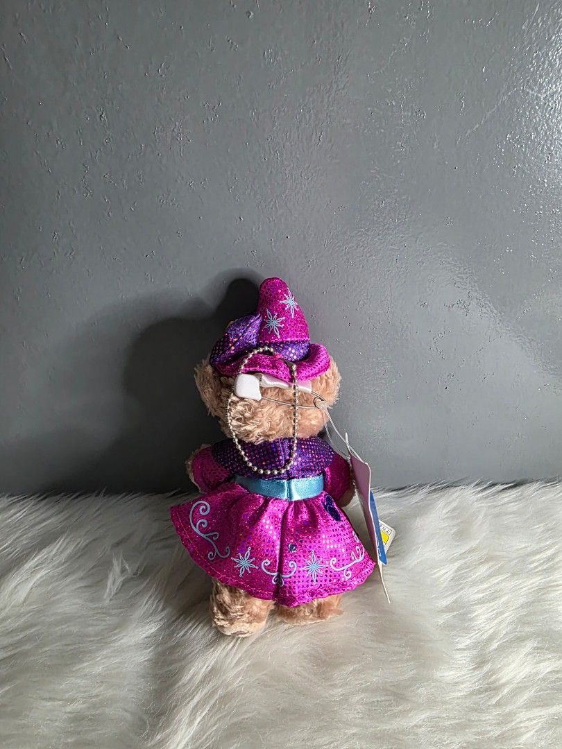 Shellie May the Disney Bear Charm (Category: Plushies & Soft Toys) located in Valenzuela. Submitted by cbianx (Listing ID 1424215701, Image 2). Description: - Shellie may the Disney Bear plush. - Dressed in a pink and purple outfit. - Features a matching hat and blue bow. - Comes with original tag. - Perfect for Disney collectors!.