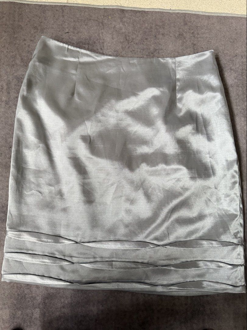Silver satin Mini Skirt with details (Category: Skirts) located in Makati City. Submitted by blingbinz (Listing ID 1424208587, Image 1). Description: - waist 26 - silver satin.