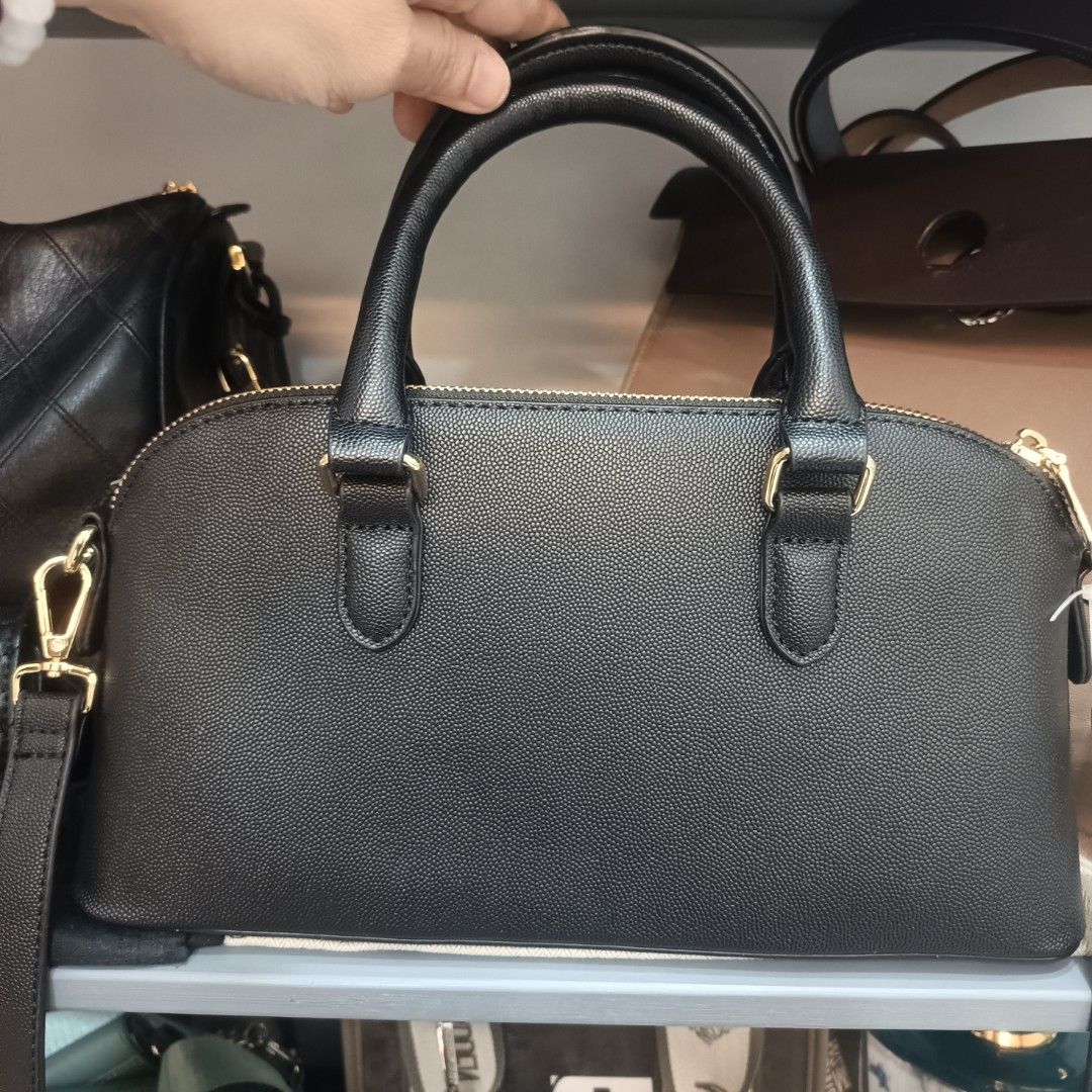 Steve Madden Galaxy Blue Dome Bag (Category: Cross-body Bags) located in Dagupan City. Submitted by nmcmp4 (Listing ID 1424237828, Image 3). Description: - Steve Madden dome bag - Color: Black - Hardware: Gold-tone - Features: Top handle, detachable shoulder strap - Details: Charm with mini bag and lock - No box - Closure: Zip - Model: "Galaxy Blue" - Original Price: $88.00.