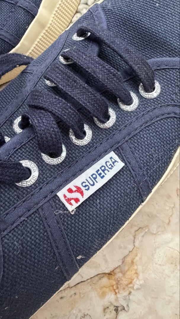 Superga Navy Blue Sneakers Size 39 (Category: Sneakers) located in Iligan City. Submitted by reemaml (Listing ID 1424337791, Image 2). Description: - Size 39 - Classic lace-up design - Features Superga logo - White sole - Canvas material.