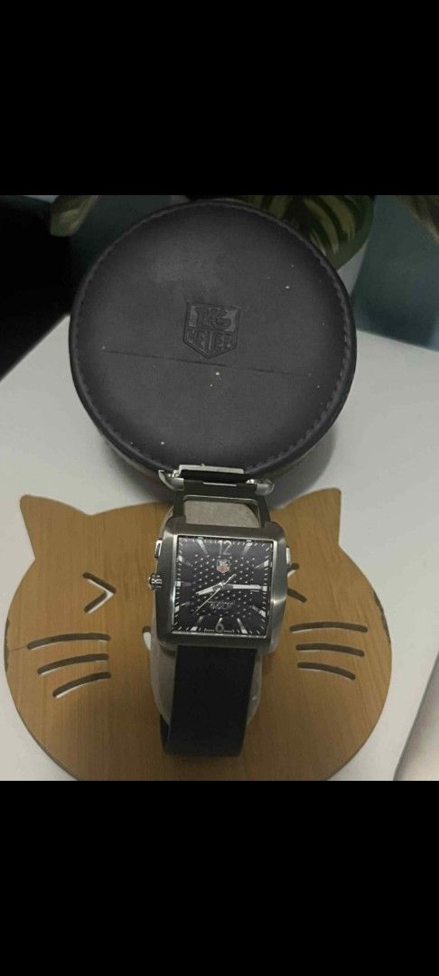 Tag Heuer Golf Watch (Category: Luxury Watches) located in Meycauayan. Submitted by redvipergf (Listing ID 1424184328, Image 1). Description: - Tag Heuer Golf Watch - Black dial and strap - Includes original case - Engraved with "GOLF WATCH by TAG Heuer" and "TIGER WOODS PROOF" - Date display at 3 o'clock.