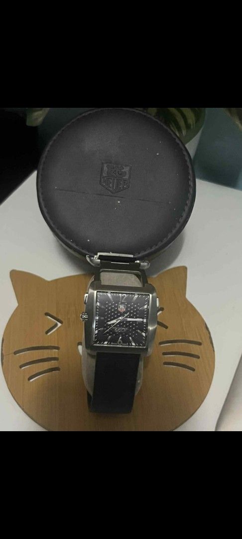 Tag Heuer Golf Watch (Category: Luxury Watches) located in Meycauayan. Submitted by redvipergf (Listing ID 1424184328, Image 2). Description: - Tag Heuer Golf Watch - Black dial and strap - Includes original case - Engraved with "GOLF WATCH by TAG Heuer" and "TIGER WOODS PROOF" - Date display at 3 o'clock.