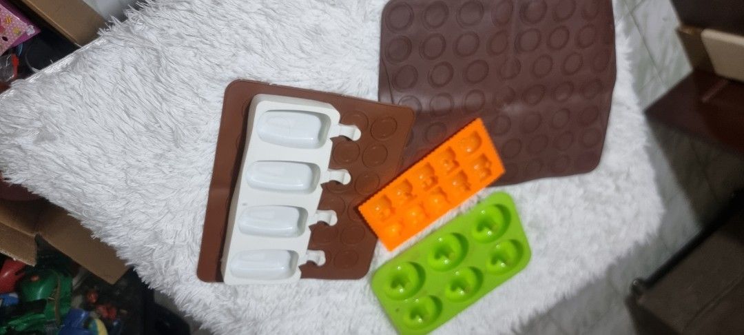 Take all Silicone Molds for Baking and Crafts (Category: Bakeware) located in Marikina City. Submitted by andreah_16 (Listing ID 1424295686, Image 3). Description: Set of silicone molds in various shapes. Includes molds for donuts, small squares, popsicle shapes, and a round patterned mat. Perfect for baking treats or crafting with resin or other materials. The molds are in different colors, offering versatility for your projects. Easy to clean a