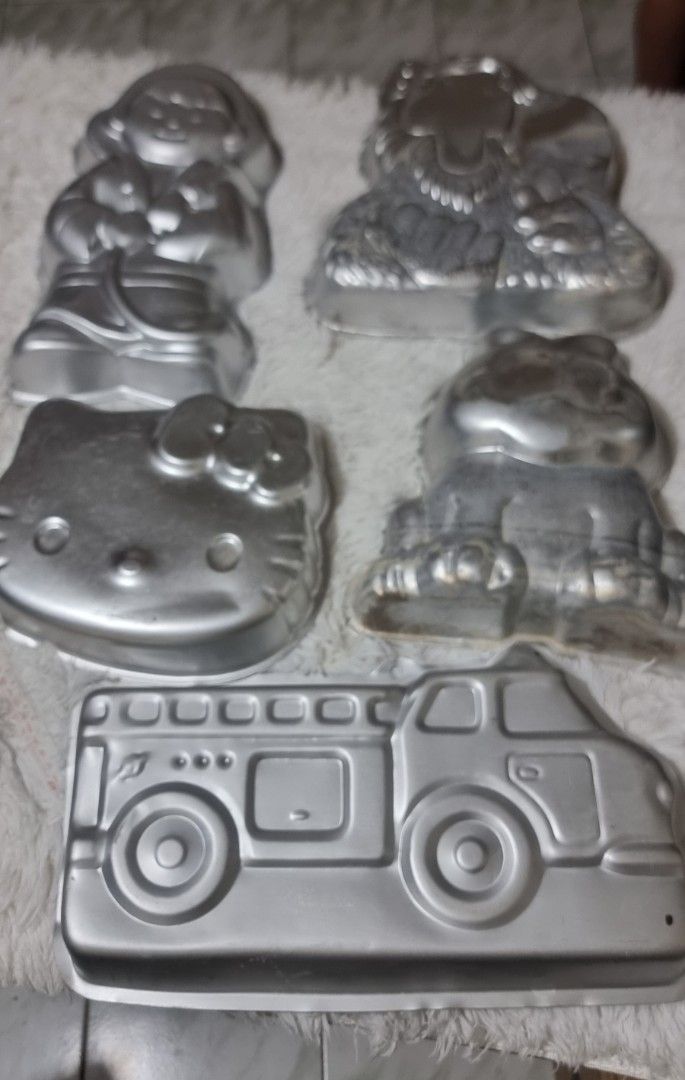 Take all Vintage Cake Molds - Assorted Designs (Category: Bakeware) located in Marikina City. Submitted by andreah_16 (Listing ID 1424295049, Image 1). Description: Set of vintage cake molds featuring various designs. Includes molds shaped like a girl, lion, Kitty, frog, and a fire truck. The fire truck mold has a cake inside themed cakes for special occasions. Great for collectors or those who enjoy unique baking tools. .