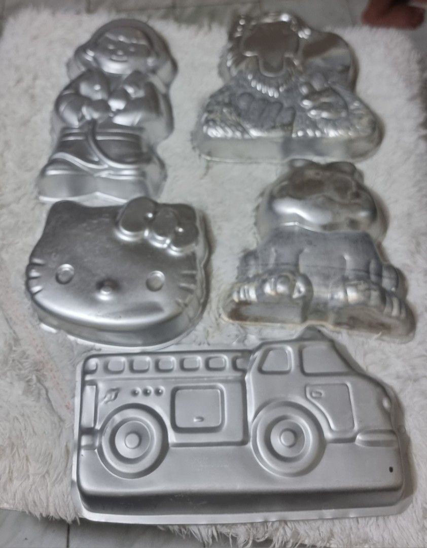 Take all Vintage Cake Molds - Assorted Designs (Category: Bakeware) located in Marikina City. Submitted by andreah_16 (Listing ID 1424295049, Image 2). Description: Set of vintage cake molds featuring various designs. Includes molds shaped like a girl, lion, Kitty, frog, and a fire truck. The fire truck mold has a cake inside themed cakes for special occasions. Great for collectors or those who enjoy unique baking tools. .