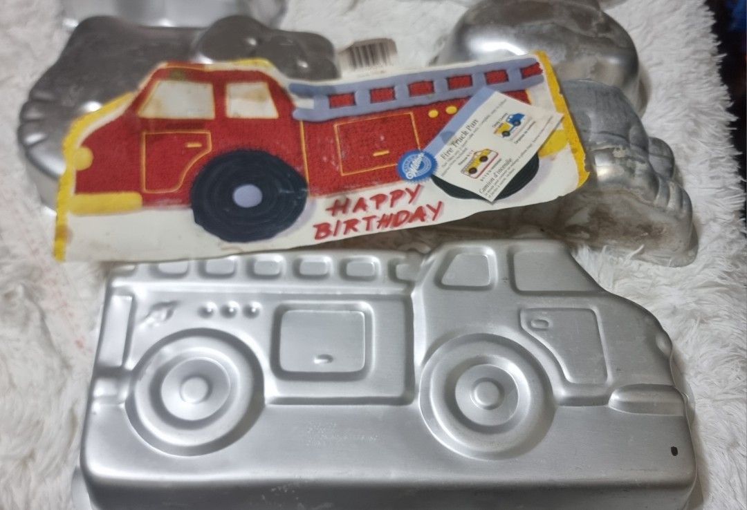 Take all Vintage Cake Molds - Assorted Designs (Category: Bakeware) located in Marikina City. Submitted by andreah_16 (Listing ID 1424295049, Image 3). Description: Set of vintage cake molds featuring various designs. Includes molds shaped like a girl, lion, Kitty, frog, and a fire truck. The fire truck mold has a cake inside themed cakes for special occasions. Great for collectors or those who enjoy unique baking tools. .