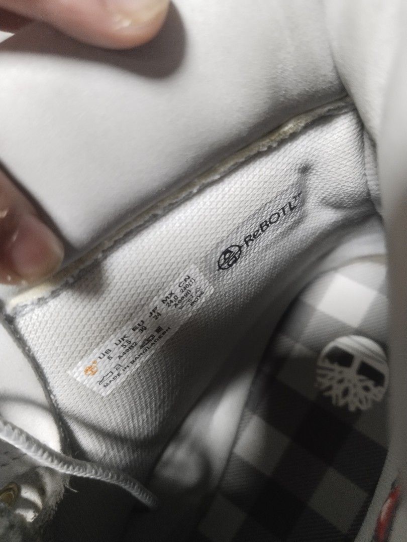 Timberland Women's Boots (Category: Boots) located in Manila. Submitted by surefwear (Listing ID 1424259495, Image 3). Description: - Light grey Timberland boots - Iconic Timberland logo - Lace-up design with gold eyelets - ReBOTL interior - Durable rubber sole - Made in Bangladesh.