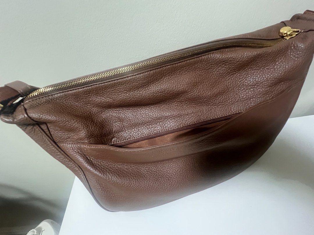Tocco Toscano Rey Crossbody Maxi (Category: Cross-body Bags) located in Taguig. Submitted by studio26 (Listing ID 1424193923, Image 3). Description: PLEASE READ THE ENTIRE POST TO SEE ANSWERS TO COMMON QUESTIONS Tocco Toscano Rey Shoulder Bag, Chocolate Material: Leather Measurements: L42.5 H22 W11cm Like new, no flaws LOCATION Antipolo / Taguig PAYMENT Cashless payment only. GCash or BPI. DELIVERY To be arranged and shouldered by buyer..