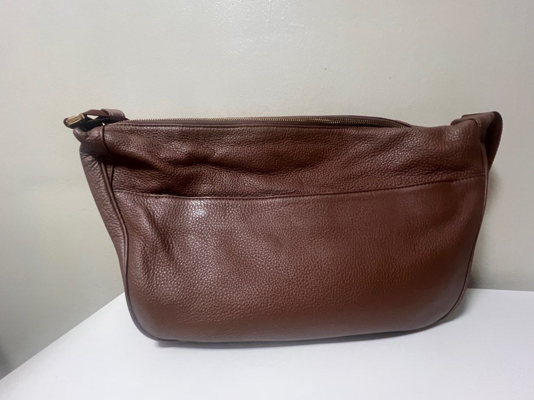Tocco Toscano Rey Crossbody Maxi (Category: Cross-body Bags) located in Taguig. Submitted by studio26 (Listing ID 1424193923, Image 2). Description: PLEASE READ THE ENTIRE POST TO SEE ANSWERS TO COMMON QUESTIONS Tocco Toscano Rey Shoulder Bag, Chocolate Material: Leather Measurements: L42.5 H22 W11cm Like new, no flaws LOCATION Antipolo / Taguig PAYMENT Cashless payment only. GCash or BPI. DELIVERY To be arranged and shouldered by buyer..