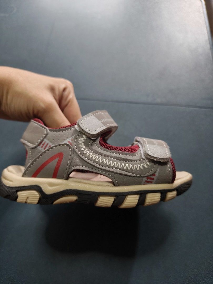 Tough Kids Sandals (Category: Babies & Kids Fashion) located in Manila. Submitted by anneesp (Listing ID 1424229646, Image 3). Description: - Tough Kids sandals - Gray and red color scheme - Adjustable straps for a secure fit - Textured soles for enhanced grip - Durable construction - Features the Tough Kids logo on the insole - Ideal for outdoor activities - 6 inches #kidsshoes #kidssandals #toddlershoes #toddlersandals #outdoorshoes #kidsfashio