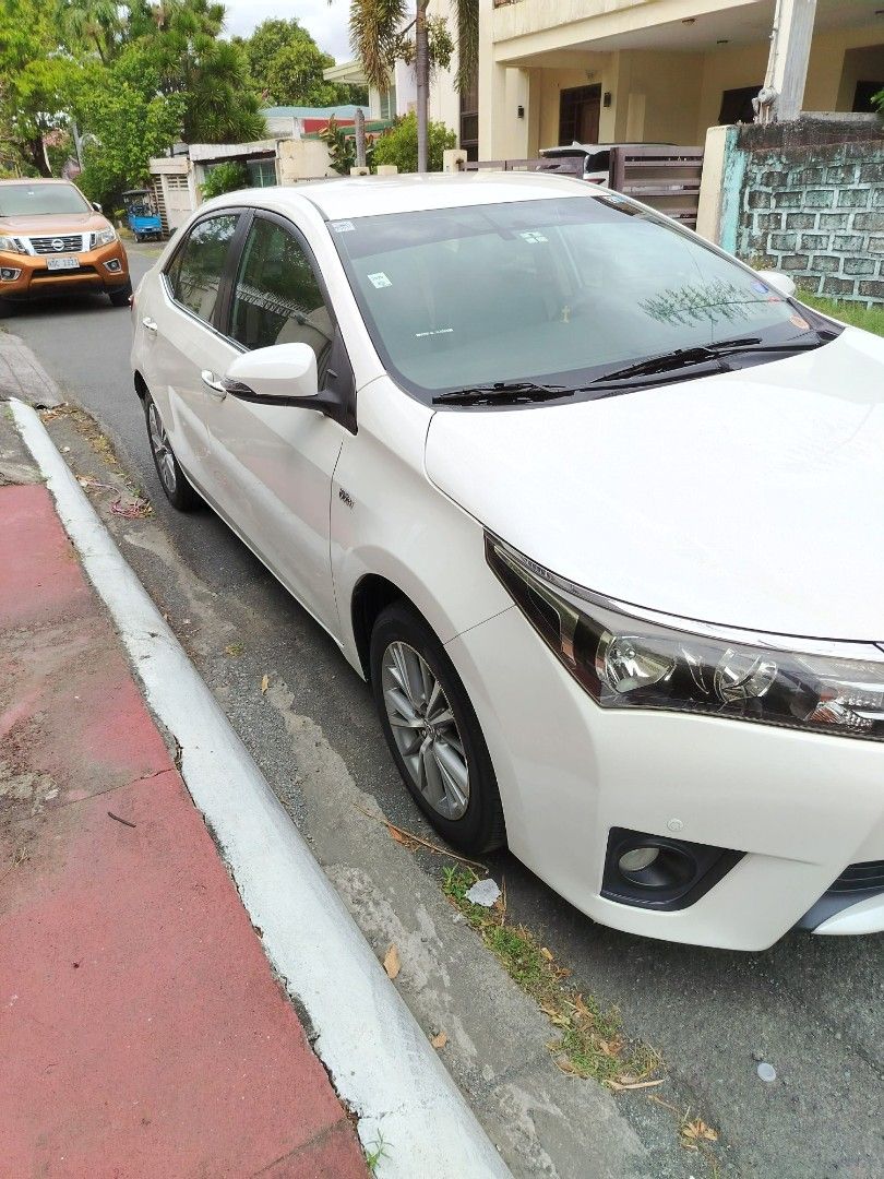 Toyota Corolla Altis 1.6 (A) (Category: Used Cars) located in Paranaque City. Submitted by gentlemanscloset (Listing ID 1424289873, Image 2). Description: Brand/Make/Model Toyota Altis 1.6V Automatic 2014 Model Highlighted details: -Pearl White - Casa maintained - Newly replaced front shock absorbers, suspension arms ball joints tie-rod end - Tires are in good condition - With comprehensive insurance - Mileage is at 70,262 kms This is still negot