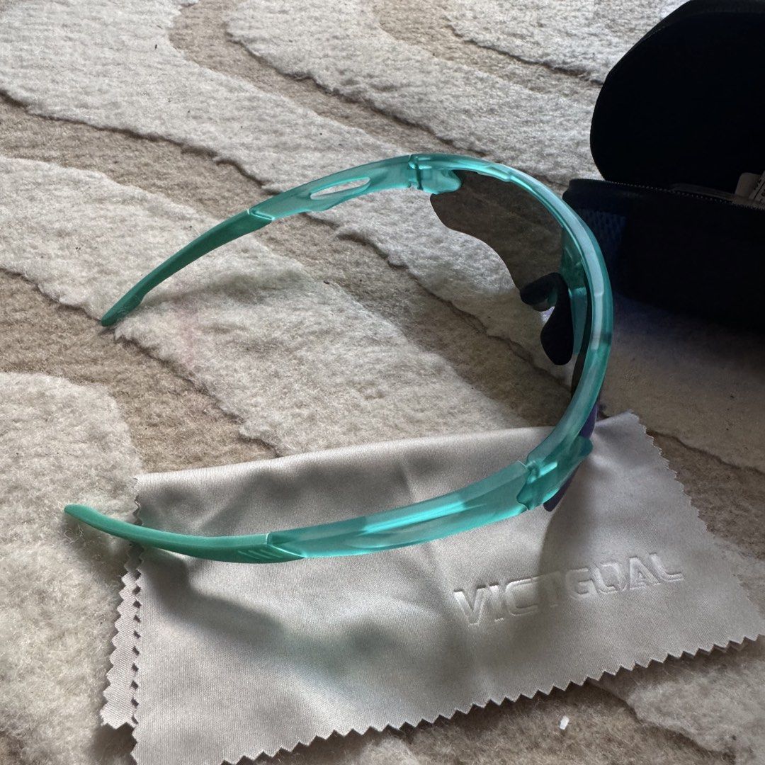 Victgoal Blue Sports Sunglasses VA312 (Category: Sunglasses & Eyewear) located in Makati City. Submitted by finders.keep.hers (Listing ID 1424258521, Image 3). Description: - Victgoal sports sunglasses - Blue-tinted lenses - Teal frame - Model: VA312 - Includes hard case with zipper closure and Victgoal logo - Comes with cleaning cloth and paperwork - Designed for sports activities.