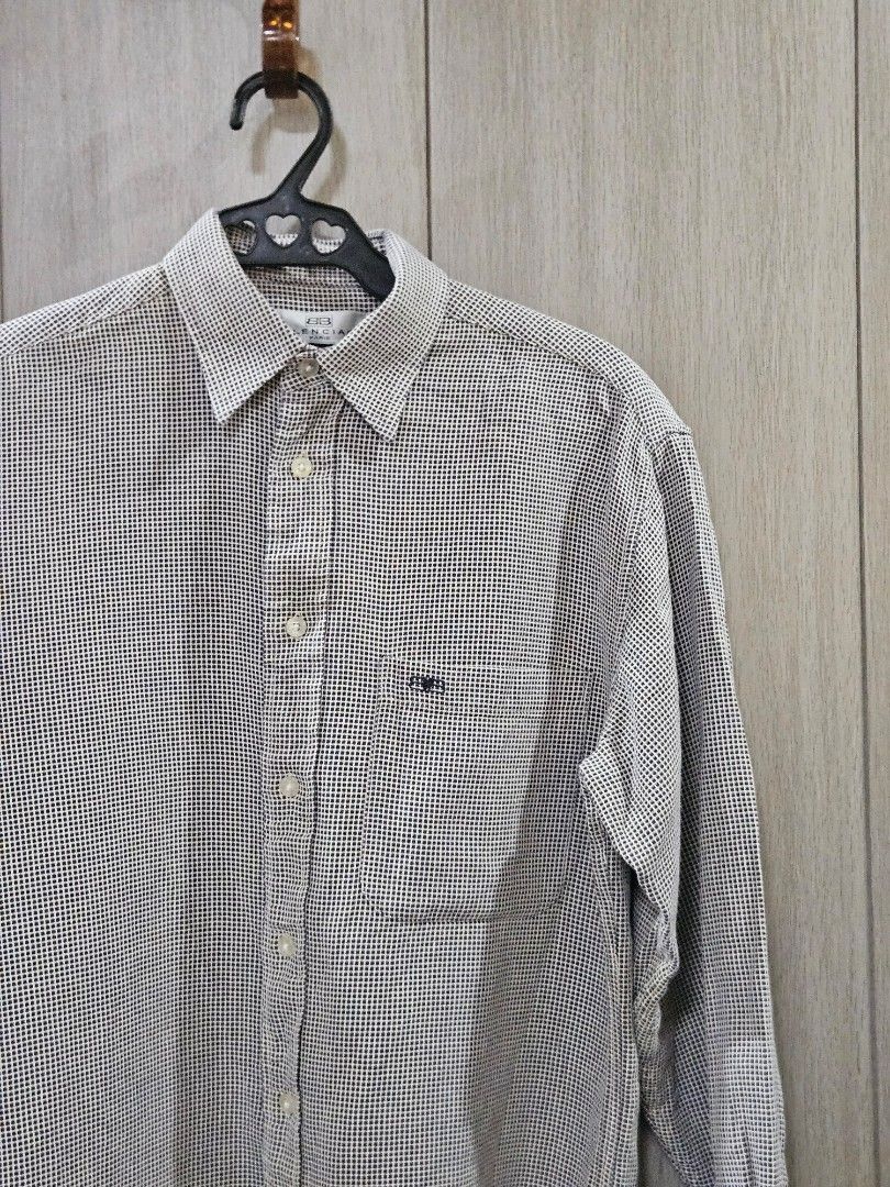 Vintage Balenciaga Checkered Button Down Shirt (Category: Tshirts & Polo Shirts ) located in Candon. Submitted by itssummer08 (Listing ID 1424217231, Image 3). Description: - Balenciaga long sleeve shirt - Checkered pattern - Button-down closure - Chest pocket - Made of 100% cotton - Size: 14-3/4 32 - Care instructions: Machine wash warm, tumble dry low, no bleach L 28in W 20.5in fit to S-M.