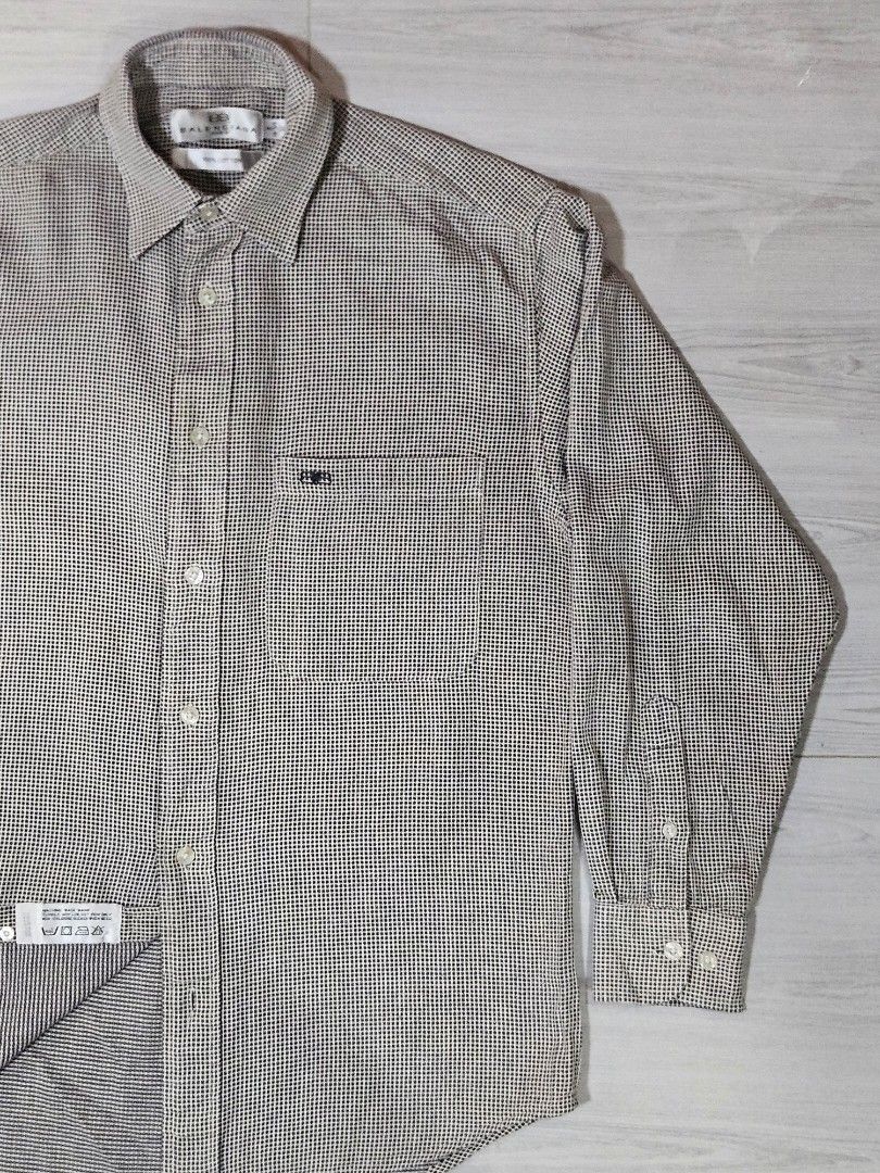 Vintage Balenciaga Checkered Button Down Shirt (Category: Tshirts & Polo Shirts ) located in Candon. Submitted by itssummer08 (Listing ID 1424217231, Image 1). Description: - Balenciaga long sleeve shirt - Checkered pattern - Button-down closure - Chest pocket - Made of 100% cotton - Size: 14-3/4 32 - Care instructions: Machine wash warm, tumble dry low, no bleach L 28in W 20.5in fit to S-M.