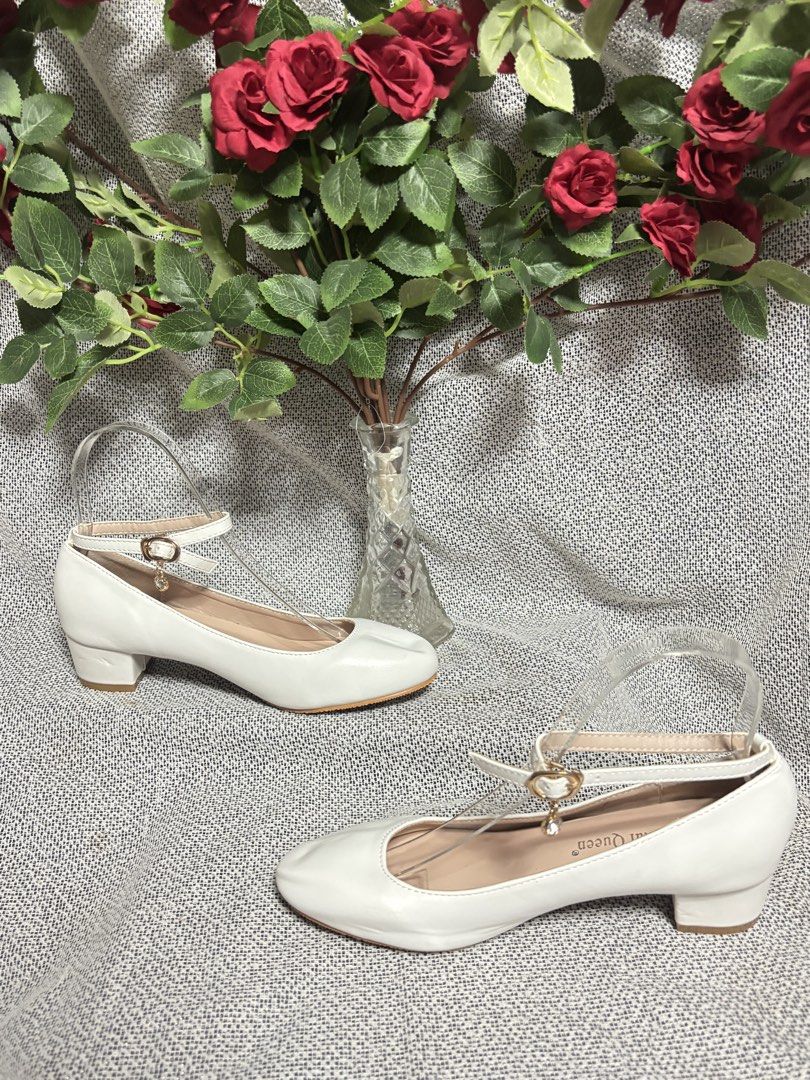 White ankle strap Block Heel Shoes (Category: Heels) located in Quezon City. Submitted by vnc.fashion.shop (Listing ID 1424189807, Image 2). Description: White round toe ankle strap low heel Size On tag: 35 insole cm:22.5 Best fit: 22 cm foot lenght heels height in inches:1.5 inches Price:500 - White Mary Jane shoes - 3cm block heel - Buckle strap - Classic design - Round toe - Comfortable fit - Ideal for weddings and special occasions.