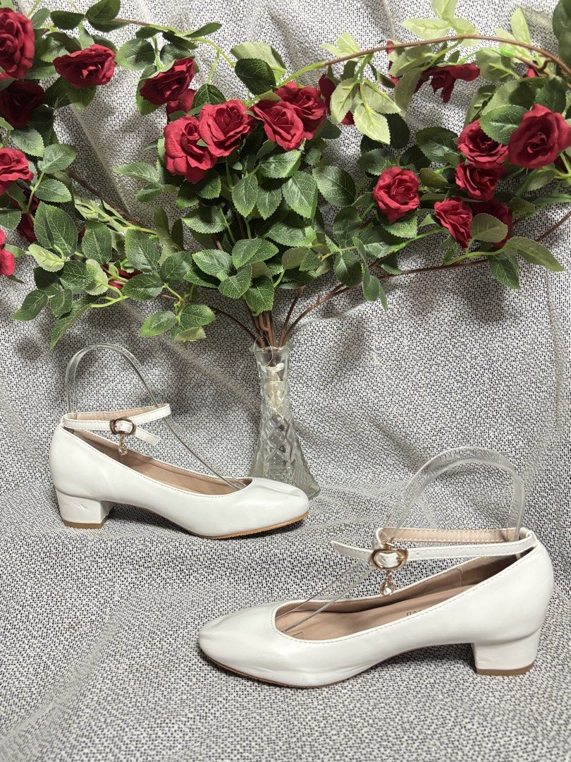 White ankle strap Block Heel Shoes (Category: Heels) located in Quezon City. Submitted by vnc.fashion.shop (Listing ID 1424189807, Image 3). Description: White round toe ankle strap low heel Size On tag: 35 insole cm:22.5 Best fit: 22 cm foot lenght heels height in inches:1.5 inches Price:500 - White Mary Jane shoes - 3cm block heel - Buckle strap - Classic design - Round toe - Comfortable fit - Ideal for weddings and special occasions.
