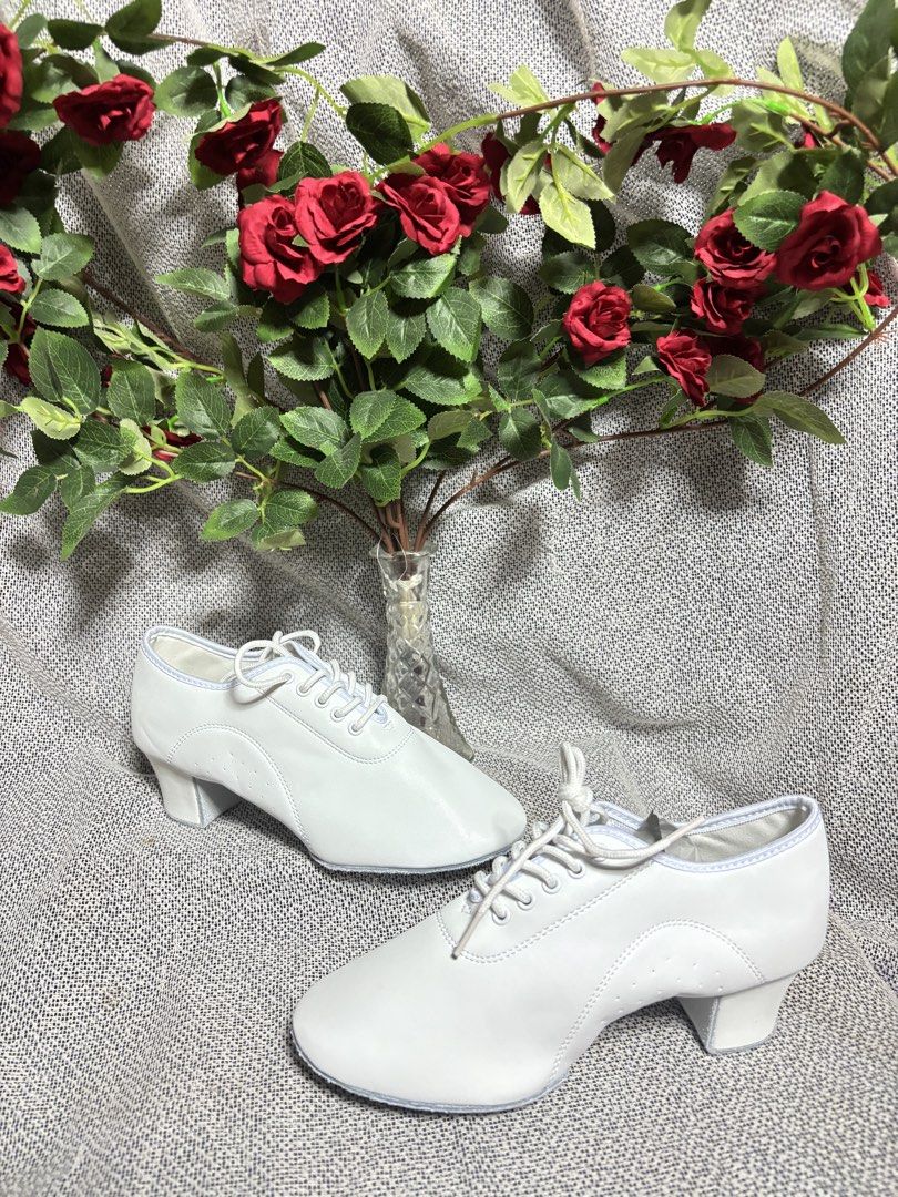White Ballroom Dance Shoes (Category: Heels) located in Quezon City. Submitted by vnc.fashion.shop (Listing ID 1424189809, Image 2). Description: dancing shoes Size On tag: 39 insole cm:24.5 Best fit: 39 heels height in inches:1.9 inches Price:450 - White ballroom dance shoes - Lace-up design - Small heel - Sole size: 39 - Suitable for ballroom dancing.