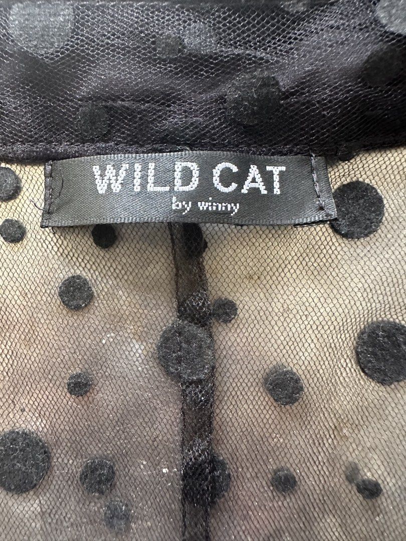 Wild Cat by Winny Polka Dot Longsleeves (Category: Longsleeves) located in Muntinlupa City. Submitted by belica (Listing ID 1424202869, Image 3). Description: - Wild Cat by Winny Longsleeves - Black with polka dot sheer overlay - Classic collar - Long sleeves - Striped bottom hem - Unique and stylish design ⚫️Black longsleeves 🤗Preloved, please manage your expectations. Bawal po sa maarte! 📌ALL SALES FINAL! 🚫No return, no exchange, no refund. 