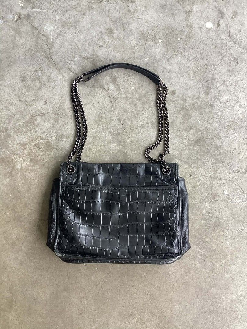 Yves Saint Laurent Leather Niki Medium (Category: Luxury Bags & Wallets) located in Cavite. Submitted by benta_bounce (Listing ID 1424231882, Image 2). Description: In good condition Measurements: 10.75" L x 3.8" W x 8.75" H Signs of usage Minimal rubs Beautiful in person Pm me for more info.