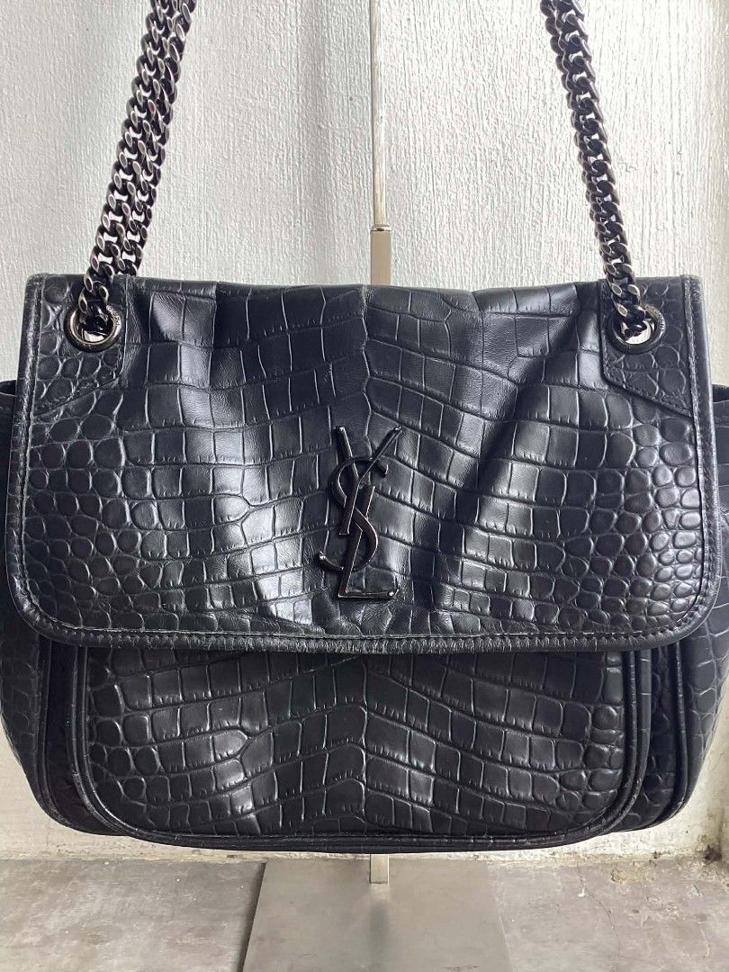 Yves Saint Laurent Leather Niki Medium (Category: Luxury Bags & Wallets) located in Cavite. Submitted by benta_bounce (Listing ID 1424231882, Image 3). Description: In good condition Measurements: 10.75" L x 3.8" W x 8.75" H Signs of usage Minimal rubs Beautiful in person Pm me for more info.