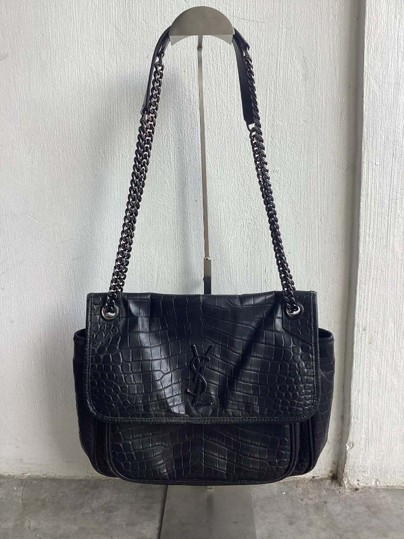 Yves Saint Laurent Leather Niki Medium (Category: Luxury Bags & Wallets) located in Cavite. Submitted by benta_bounce (Listing ID 1424231882, Image 1). Description: In good condition Measurements: 10.75" L x 3.8" W x 8.75" H Signs of usage Minimal rubs Beautiful in person Pm me for more info.