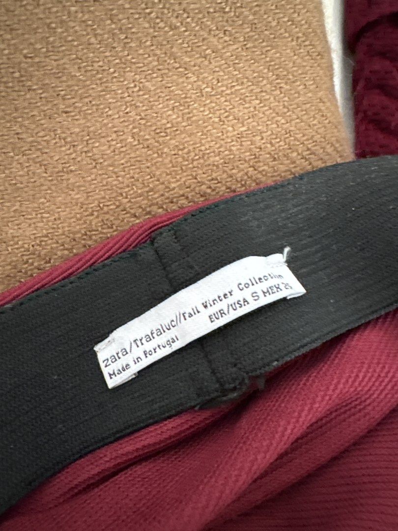Zara Trafaluc Fall Winter Collection Skirt (Category: Skirts) located in Imus. Submitted by _declutterby (Listing ID 1424189099, Image 2). Description: - Zara Trafaluc Burgundy Skirt - Asymmetrical design - Size: EUR/USA S, MEX 26 - Features an elastic waistband - Made in Portugal - From the Fall Winter Collection.