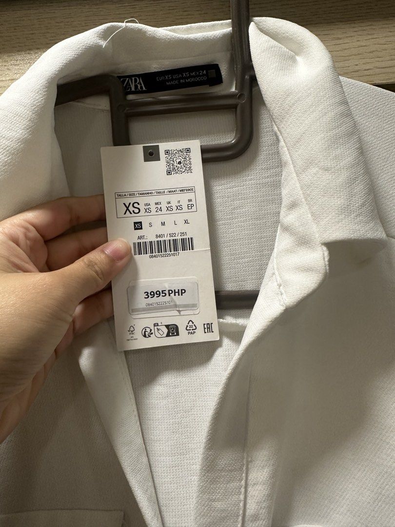 Zara White Dress XS (Category: Dresses) located in Quezon City. Submitted by classythreads (Listing ID 1424282999, Image 3). Description: - Zara white dress - Size: XS - Features: - Collared neckline - Button-down front - Long sleeves - Matching belt - Two front pockets - Made in Morocco.