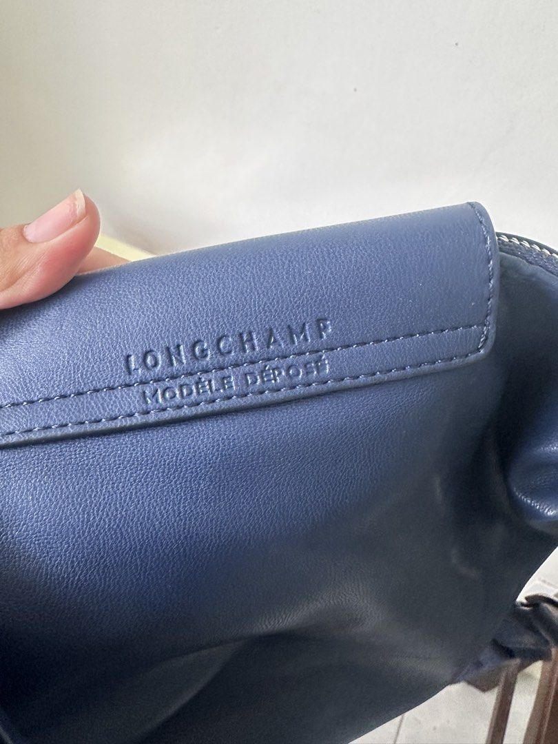 Authentic Longchamp Mondele Depose (Category: Luxury Bags & Wallets) located in Batangas. Submitted by stelaboutique (Listing ID 1427539762, Image 3). Description: With original paperbag and dustbag Only flaw as seen on the photo.