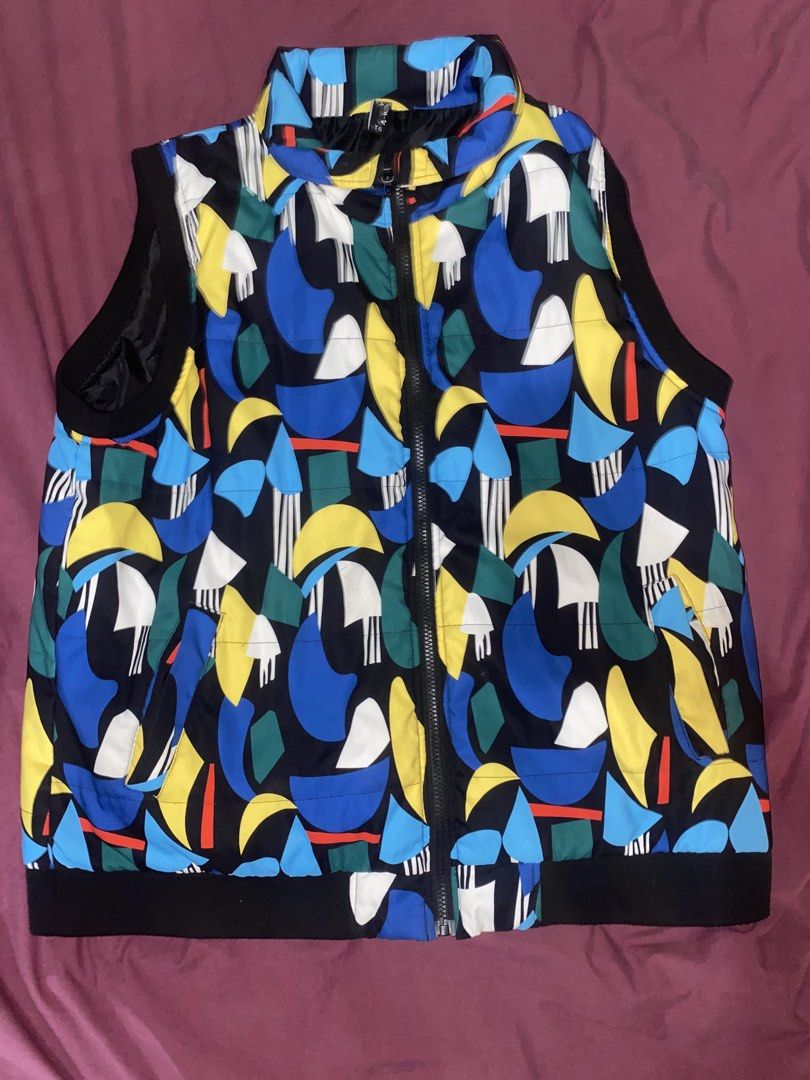 A-WIN Abstract Print Vest (Category: Vests) located in Manila. Submitted by jessymessy_dadealer (Listing ID 1427568544, Image 1). Description: Stylish vest featuring a vibrant abstract print. It has a full-length zipper and a stand-up collar. The vest is sleeveless with black trim along the armholes and hem. The size is T6. The vest is padded for warmth and comfort. It has a unique and eye-catching design..