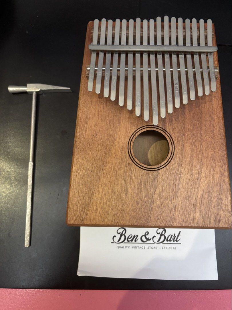Ben & Bart Kalimba (Category: Musical Instruments) located in Pasig City. Submitted by lovebird30 (Listing ID 1427628679, Image 1). Description: - Used once or twice - Nakatambak lang - No issues - Needs a bit of cleaning - Comes with dust bag, hammer, and music sheet.