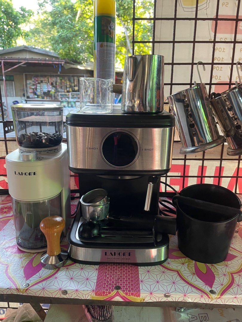 Beverage Equipment Bundle - Sealer, Espresso Machine, Blender (Category: Coffee Machines & Makers) located in Bacoor. Submitted by prelovedbyphaty (Listing ID 1427498324, Image 2). Description: Complete beverage business starter kit! Includes a cup sealing machine with printed film, a Lahome espresso machine with grinder, a 6L insulated beverage dispenser, various flavor powders, syrup bottles, and a Bardefu electric blender. Perfect for starting