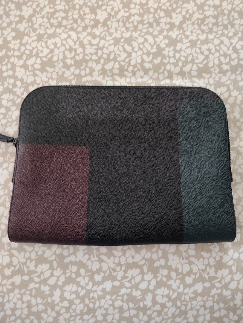 Burberry Clutch /Laptop Bag (Category: Luxury Bags & Wallets) located in Manila. Submitted by dcsago (Listing ID 1427489142, Image 3). Description: - Burberry Clutch / Laptop Bag - Unisex design - Features a modern color-block pattern - Includes the iconic Burberry check lining - Stylish and functional.